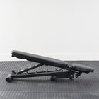 Banc de musculation XM Fitness FID replié pour le rangement